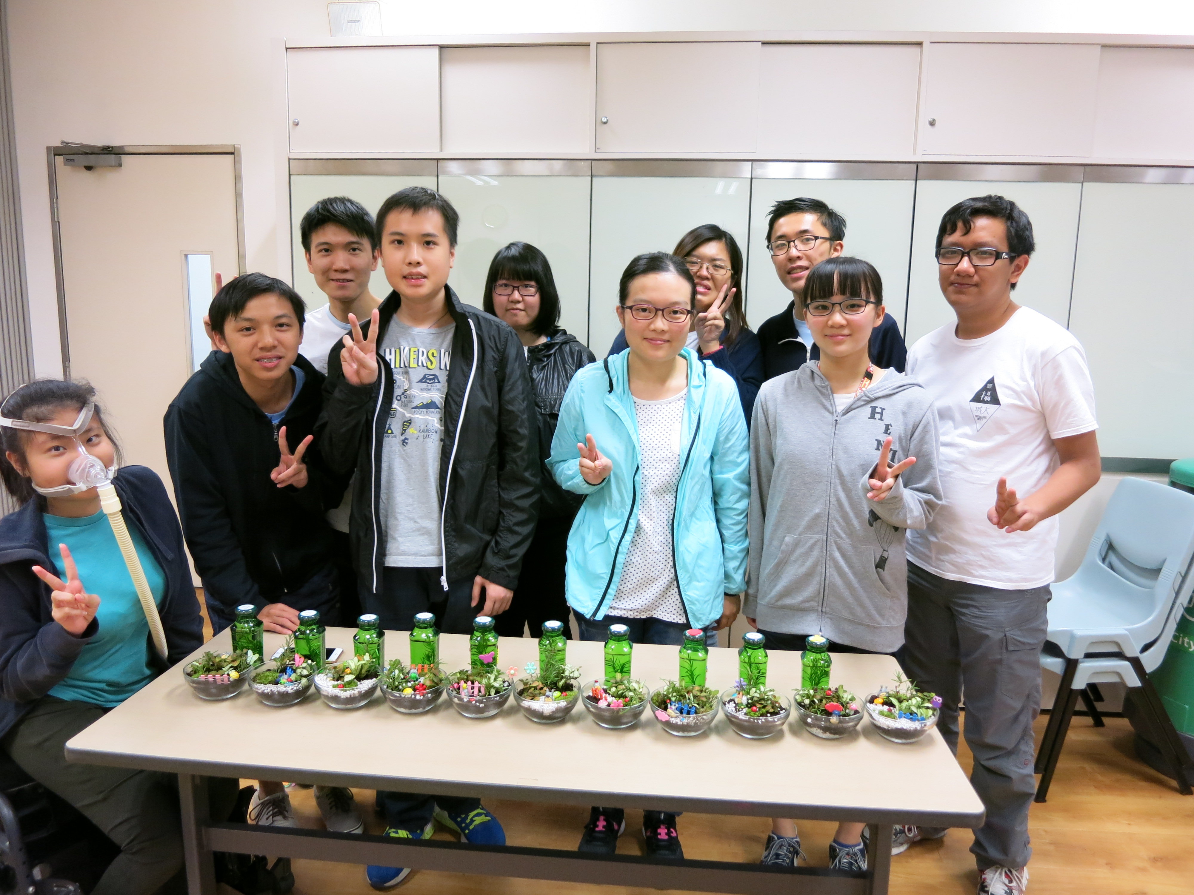 A group photo of the students and their plant products together with a feeling of satisfactory showing from their faces. 